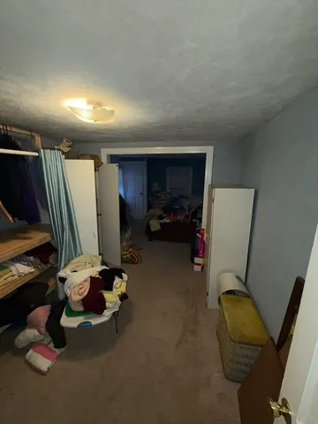 a room with furniture and gym equipment