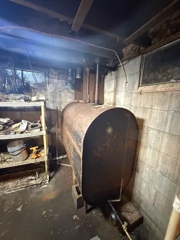 a room with water heater and racks