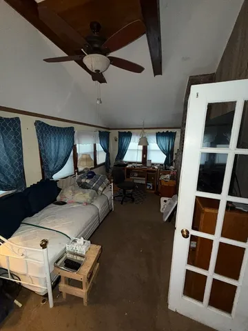 a living room with furniture and a rug