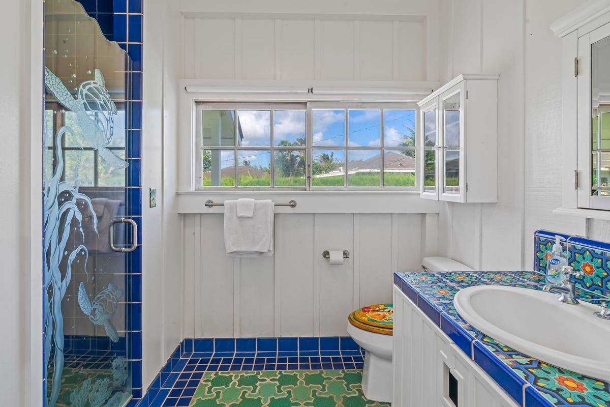 1085 Moanakai Road Kapaa, HI 96746 - Photo 11 of 24 a bathroom with a sink a toilet and a window