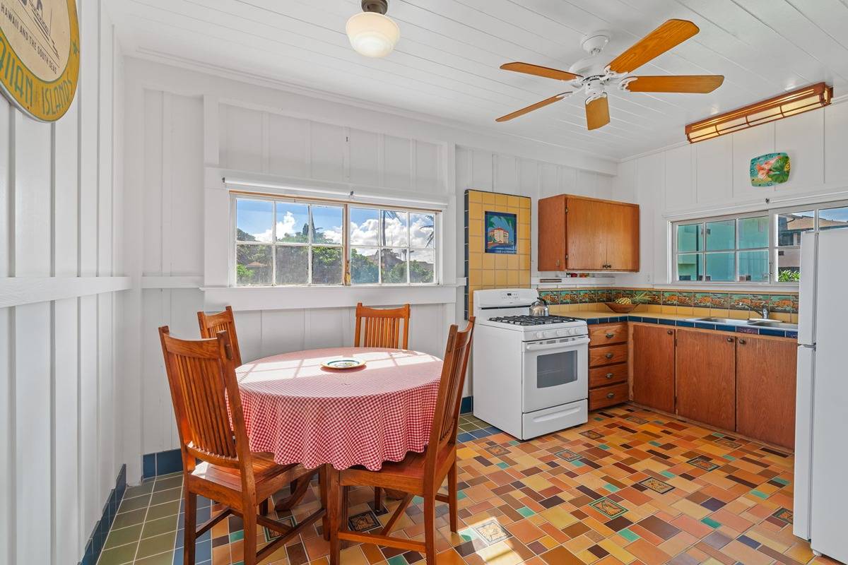 1085 Moanakai Road Kapaa, HI 96746 - Photo 5 of 24 a kitchen with a dining table chairs and stainless steel appliances
