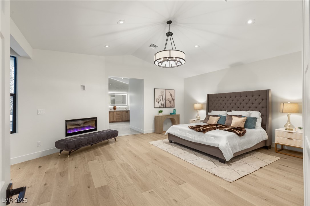 2316 Prometheus Court Henderson, NV 89074 - Photo 26 of 92 Bedroom featuring light wood-style flooring, a notable chandelier, and visible vents