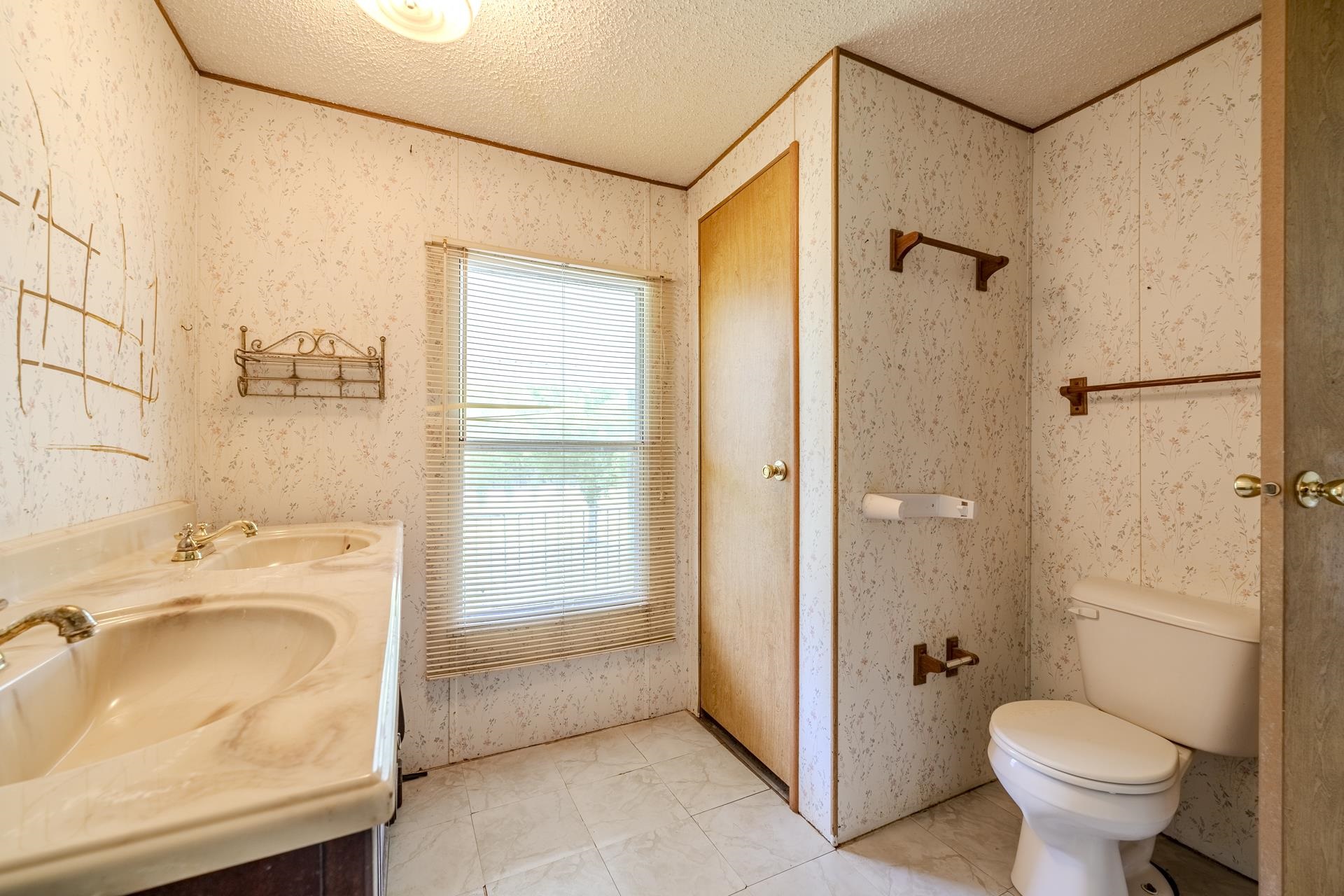 859 Old Morris Chapel Road Adamsville, TN 38310 - Photo 20 of 39 Dual basin vanity with integrated sinks and brass-finish fixtures