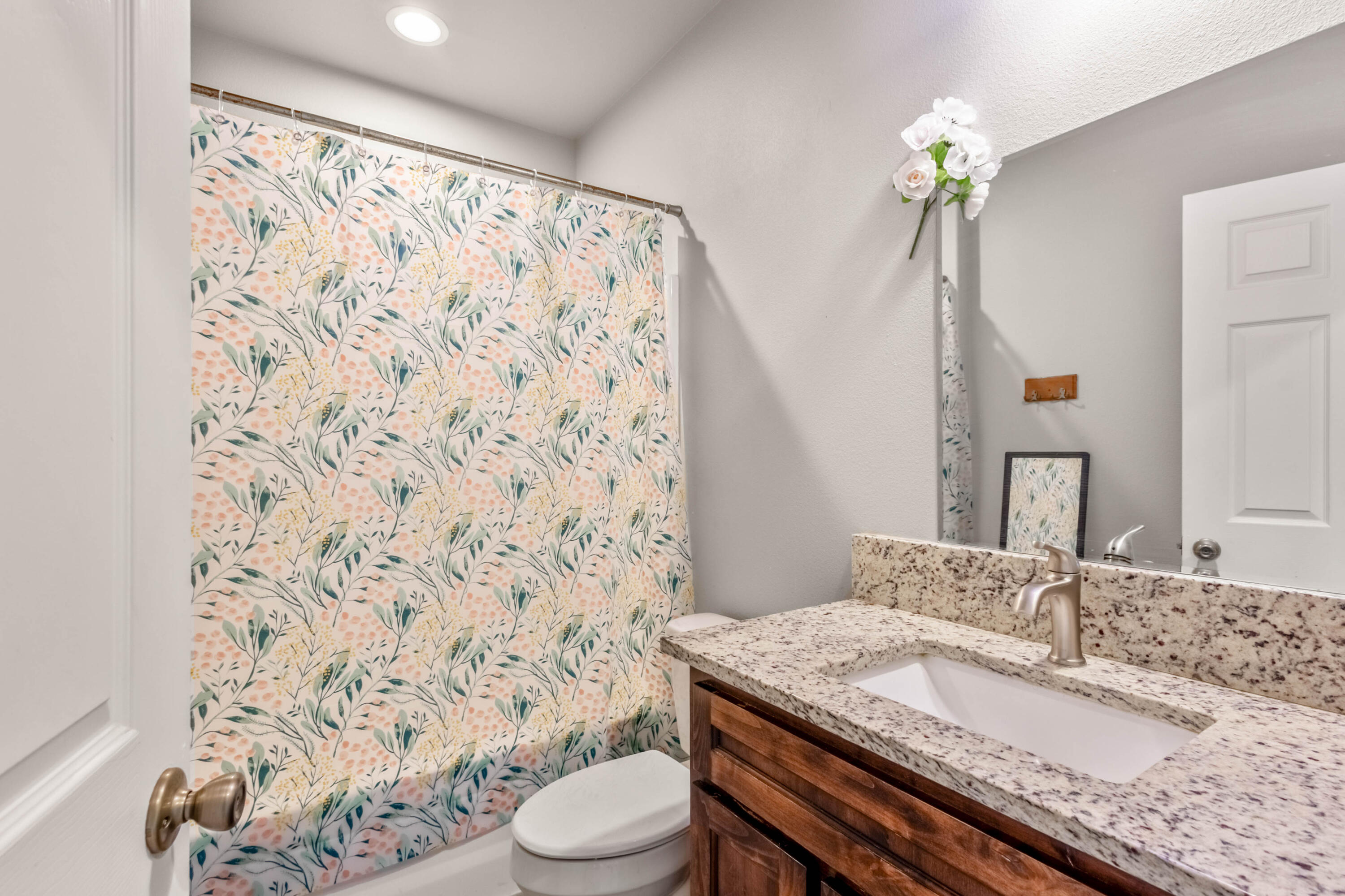 539 Leisek Way Madras, OR 97741 - Photo 21 of 35 a bathroom with a granite countertop sink a toilet and a mirror
