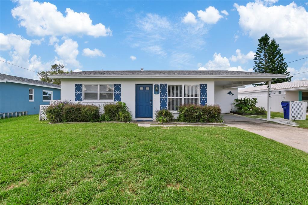 4424 Floramar Terrace New Port Richey, FL 34652 - Photo 1 of 1 a view of a house with backyard and garden