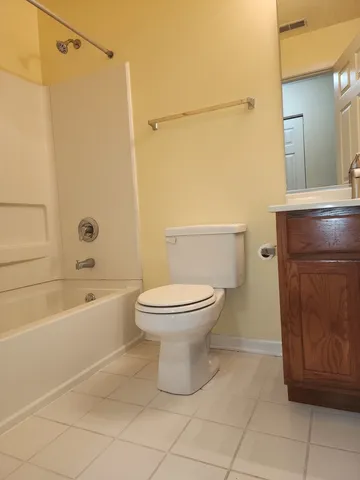 a bathroom with a toilet and a bathtub