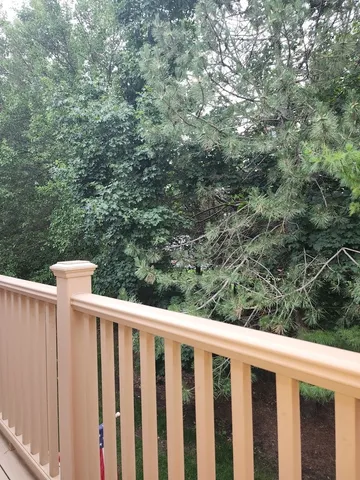 a balcony with wooden fence