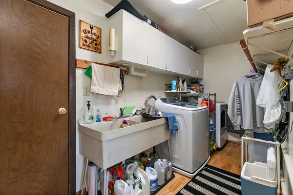 a bathroom with a sink toilet and mirror