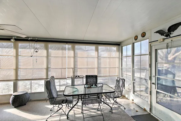 a workspace with furniture and window