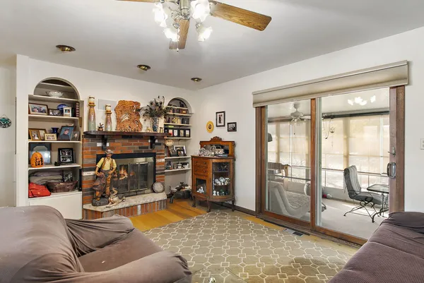 a view of a livingroom with workspace and a window