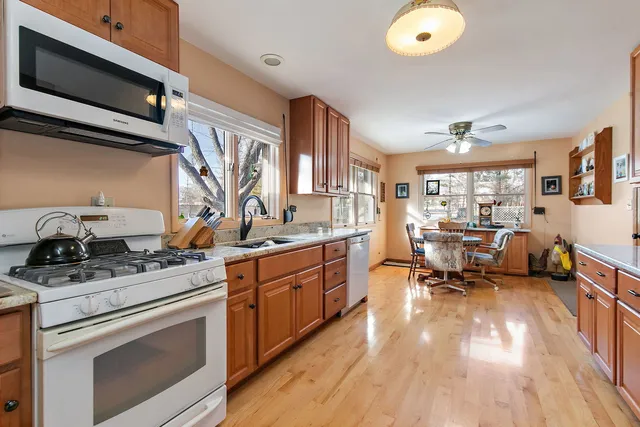 a kitchen with sink stove and cabinets