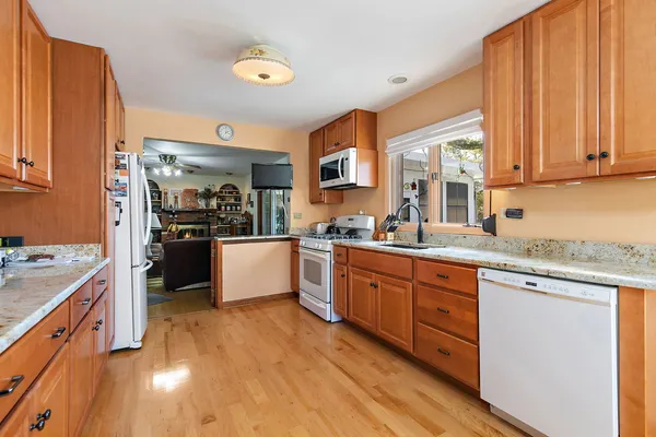 a kitchen with stainless steel appliances granite countertop a stove and cabinets