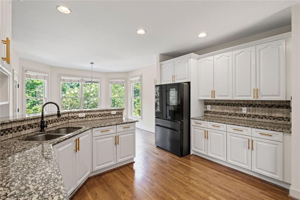 12857 Waterside Drive Alpharetta, GA 30004 - Photo 13 of 60 a kitchen with a sink stove and refrigerator