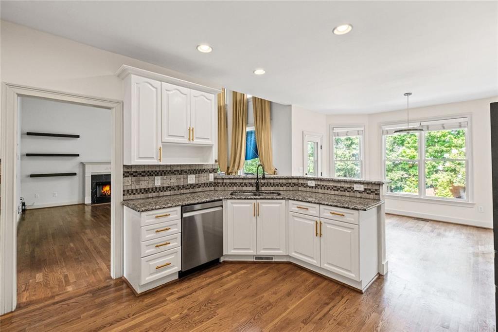12857 Waterside Drive Alpharetta, GA 30004 - Photo 14 of 60 a kitchen with stainless steel appliances granite countertop a stove and a sink