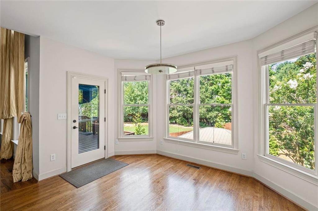12857 Waterside Drive Alpharetta, GA 30004 - Photo 17 of 60 a view of a room with window wooden floor and front door