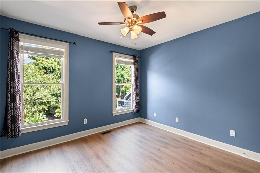 12857 Waterside Drive Alpharetta, GA 30004 - Photo 18 of 60 wooden floor in an empty room with a window