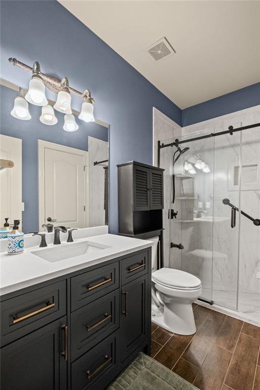 12857 Waterside Drive Alpharetta, GA 30004 - Photo 19 of 60 a bathroom with a sink toilet double vanity and shower