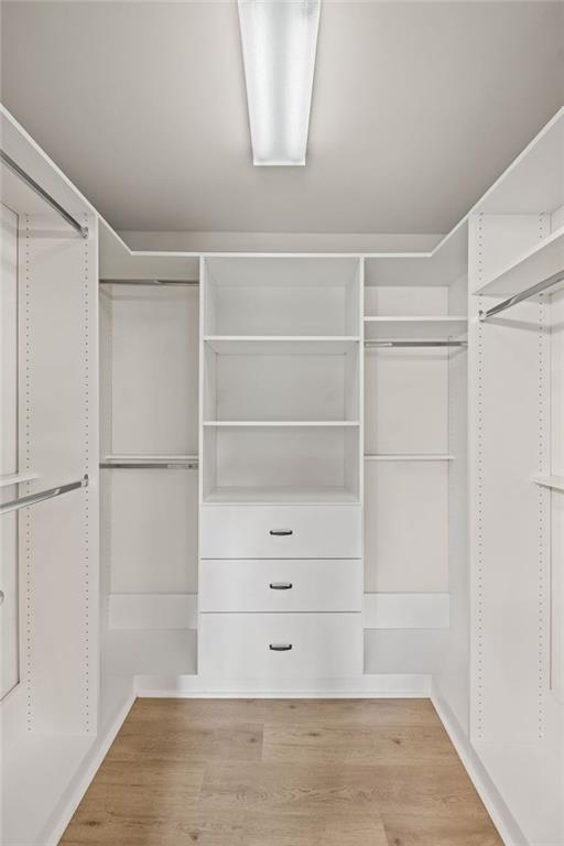 12857 Waterside Drive Alpharetta, GA 30004 - Photo 27 of 60 a view of walk in closet with empty racks