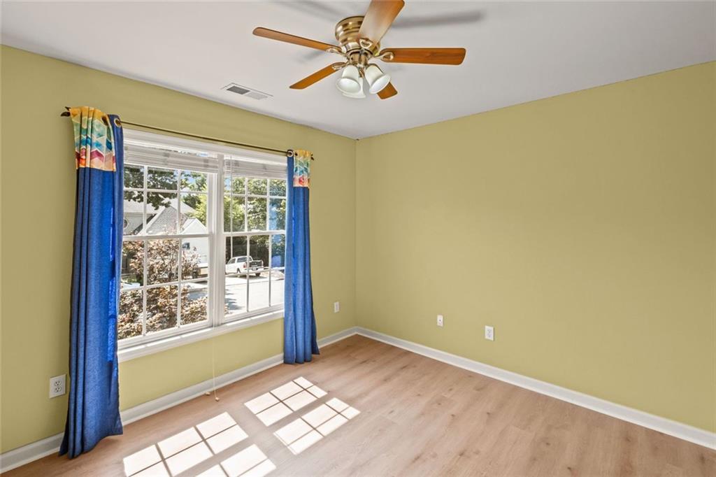 12857 Waterside Drive Alpharetta, GA 30004 - Photo 28 of 60 a view of an empty room with a window