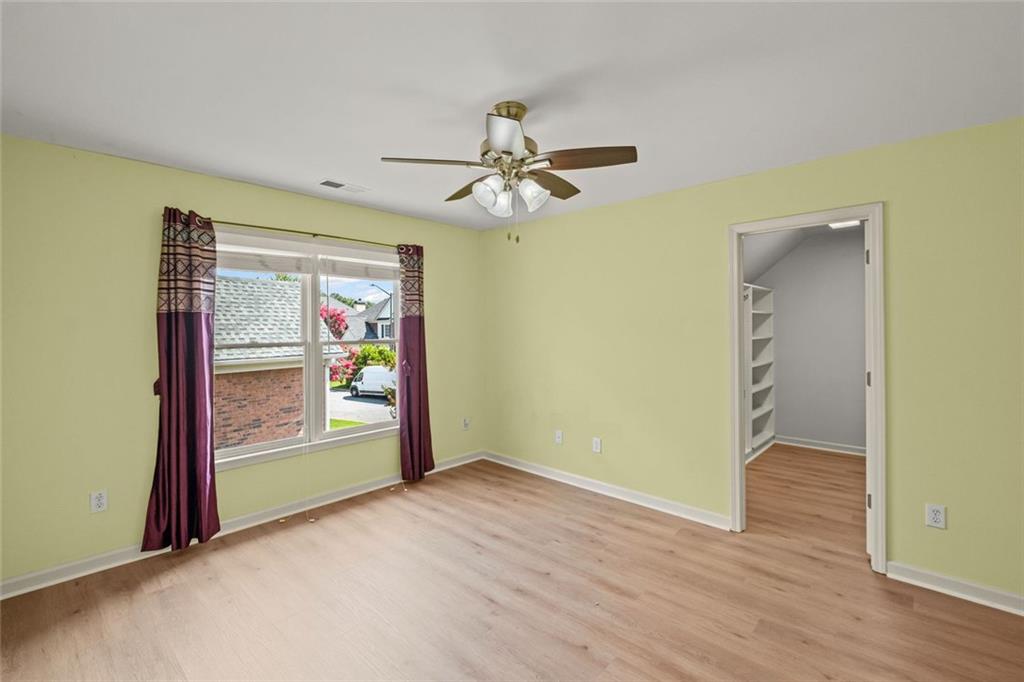 12857 Waterside Drive Alpharetta, GA 30004 - Photo 29 of 60 an empty room with fan and windows