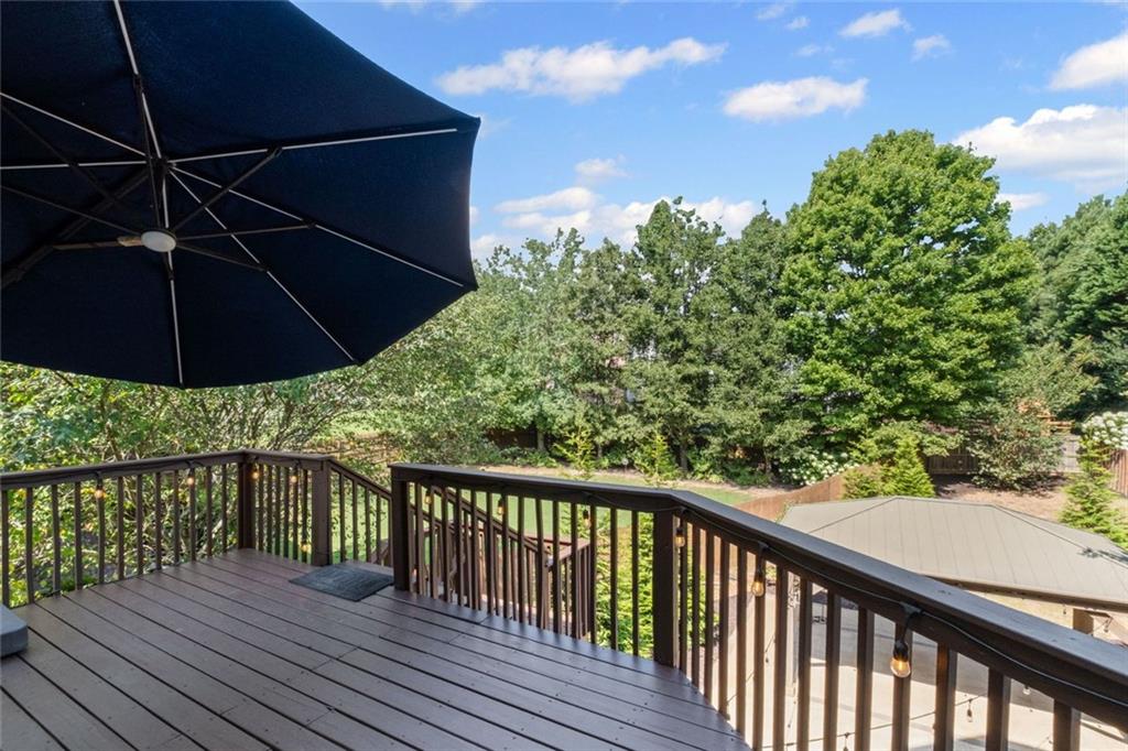 12857 Waterside Drive Alpharetta, GA 30004 - Photo 41 of 60 a view of a balcony with wooden floor and fence