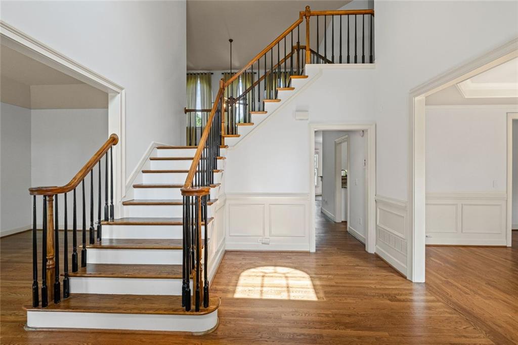 12857 Waterside Drive Alpharetta, GA 30004 - Photo 6 of 60 a view of entryway and hall with wooden floor