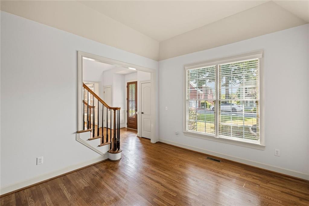 12857 Waterside Drive Alpharetta, GA 30004 - Photo 7 of 60 wooden floor in an empty room with a window