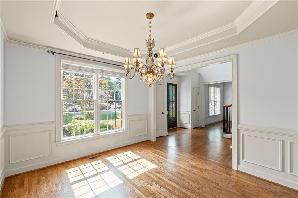 12857 Waterside Drive Alpharetta, GA 30004 - Photo 8 of 60 a view of an empty room with window and wooden floor