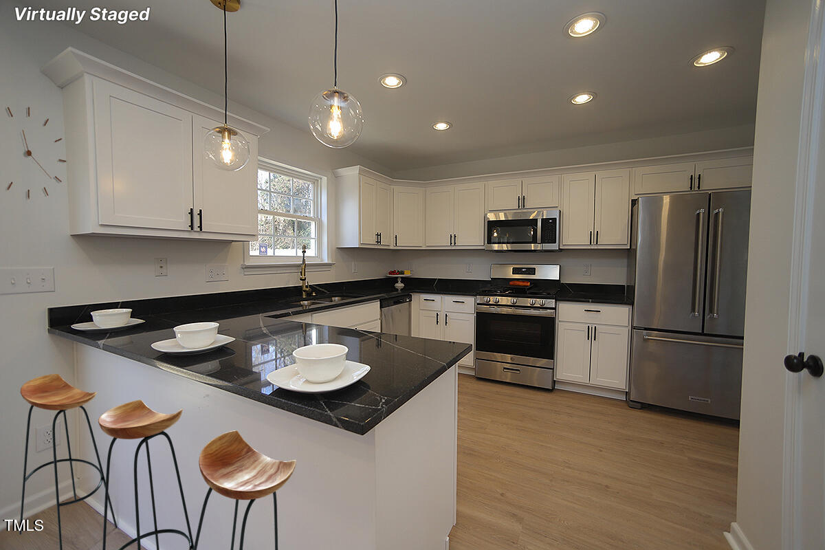 3244 Marcony Way Raleigh, NC 27610 - Photo 7 of 30 Kitchen/ w/ Peninsula