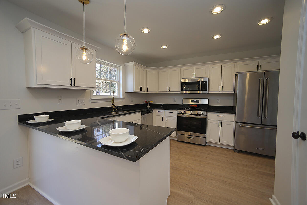 3244 Marcony Way Raleigh, NC 27610 - Photo 8 of 30 Kitchen w/ Peninsula