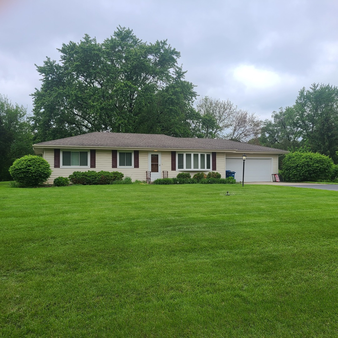 12N238 Hilltop Road Elgin, IL 60124 - Photo 1 of 21 a view of house with a yard