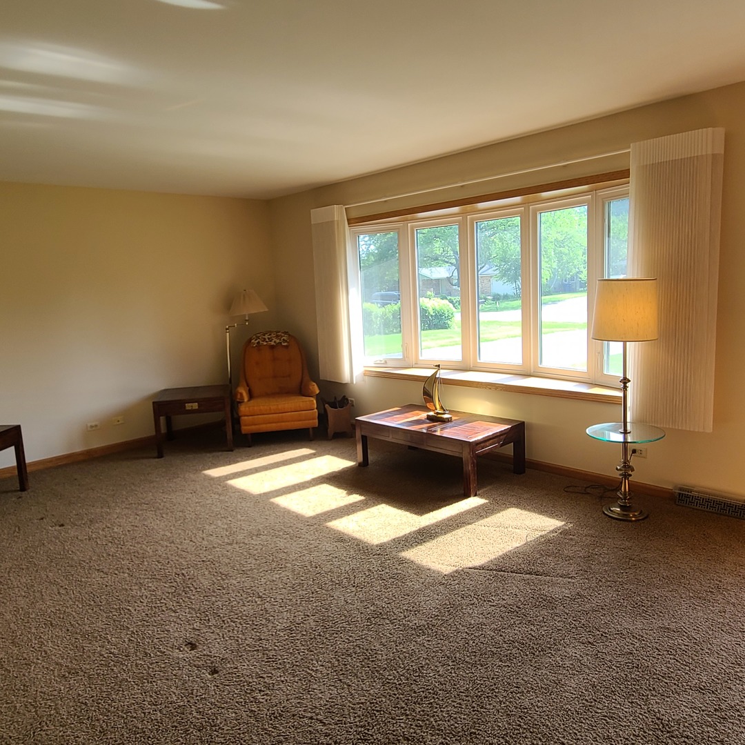 12N238 Hilltop Road Elgin, IL 60124 - Photo 7 of 21 a living room with furniture and a window