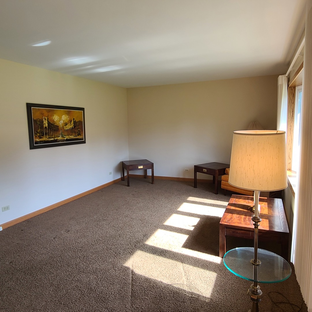 12N238 Hilltop Road Elgin, IL 60124 - Photo 8 of 21 a living room with furniture and a lamp