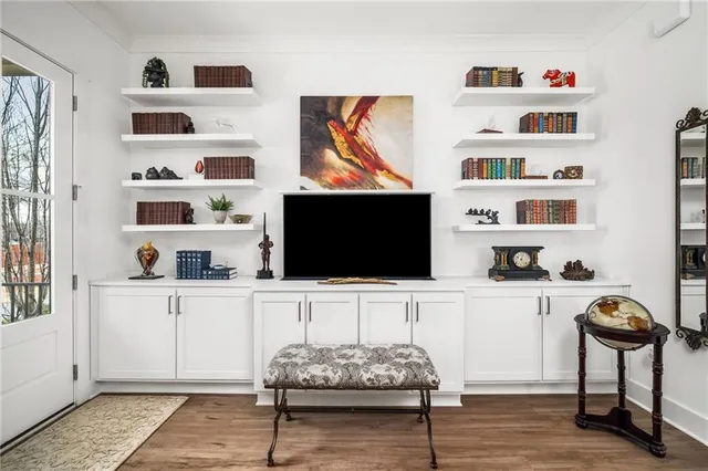 a kitchen with stainless steel appliances granite countertop a sink stove and refrigerator with wooden floor