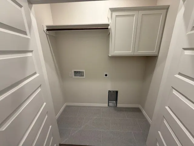 a view of storage and utility room with washer and dryer