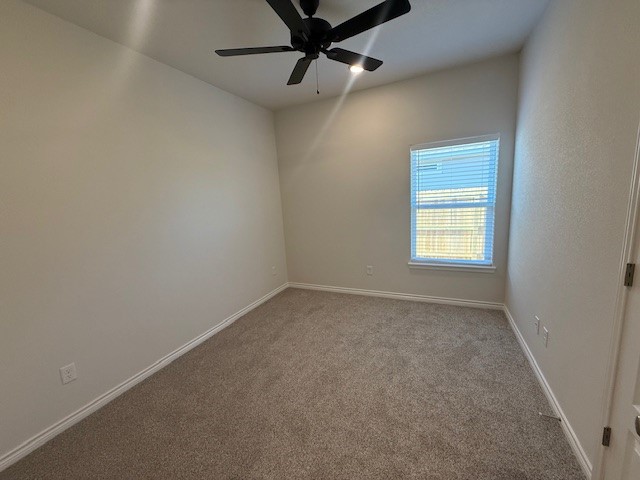 7804 Redbud Road Navasota, TX 77868 - Photo 12 of 25 an empty room with a window and a fan