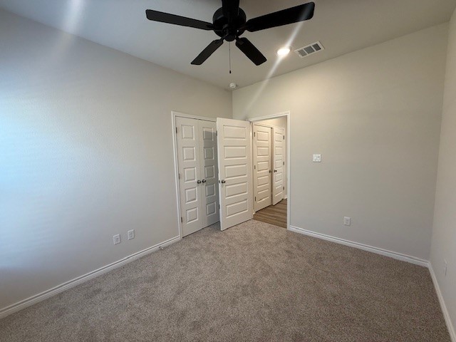 7804 Redbud Road Navasota, TX 77868 - Photo 13 of 25 an empty room with chandelier fan