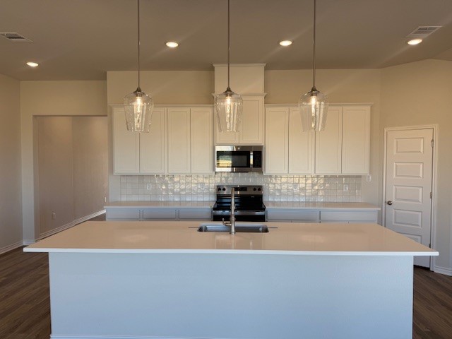 7804 Redbud Road Navasota, TX 77868 - Photo 14 of 25 a kitchen with kitchen island a sink table and chairs