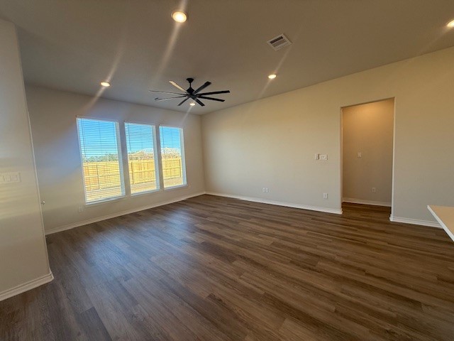 7804 Redbud Road Navasota, TX 77868 - Photo 16 of 25 a view of an empty room with a window and wooden floor