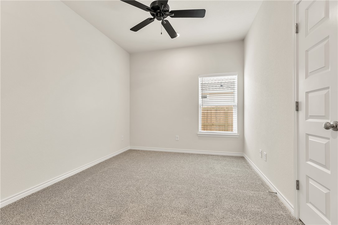 7804 Redbud Road Navasota, TX 77868 - Photo 20 of 26 an empty room with windows and fan