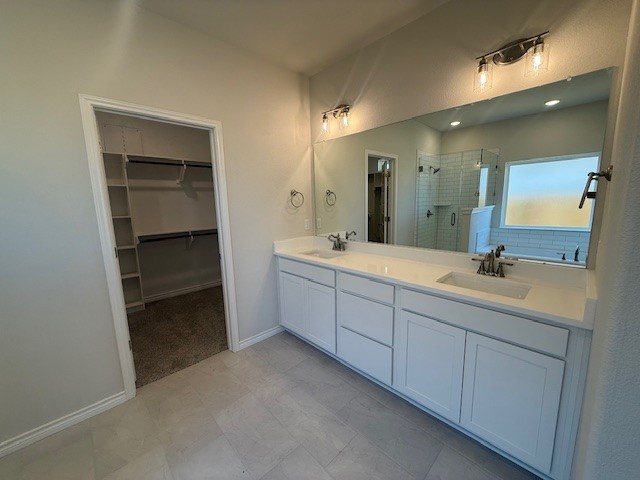 7804 Redbud Road Navasota, TX 77868 - Photo 21 of 25 a bathroom with a double vanity sink and mirror