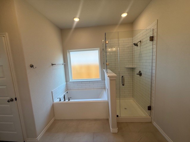7804 Redbud Road Navasota, TX 77868 - Photo 22 of 25 a bathroom with a tub and shower