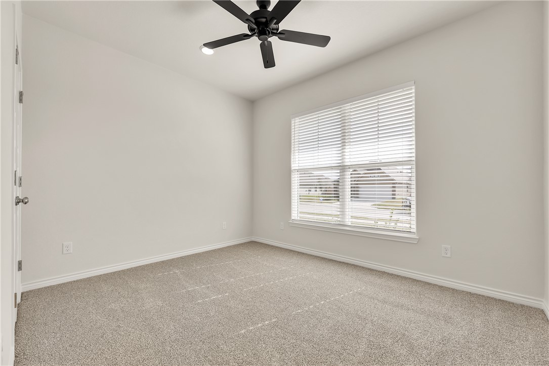 7804 Redbud Road Navasota, TX 77868 - Photo 24 of 26 an empty room with a window and a fan