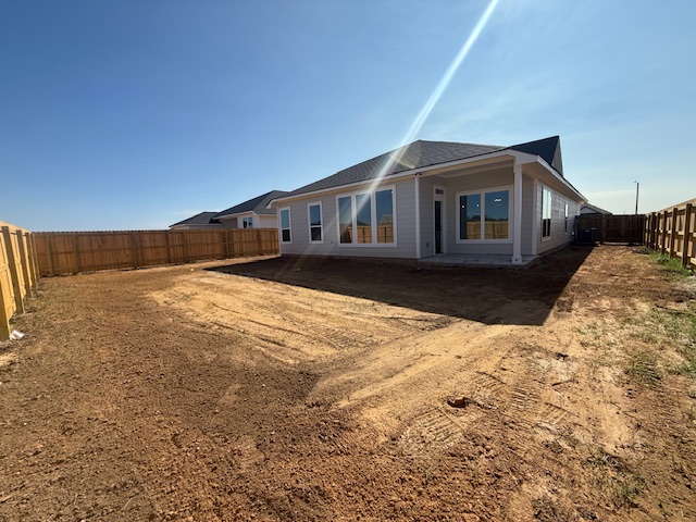 7804 Redbud Road Navasota, TX 77868 - Photo 24 of 25 a backyard of a house with wooden fence