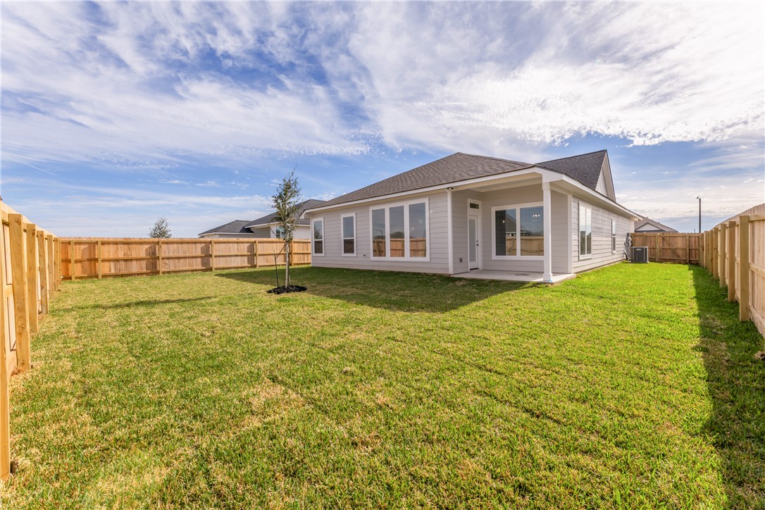 7804 Redbud Road Navasota, TX 77868 - Photo 26 of 26 a view of a house with pool and a yard