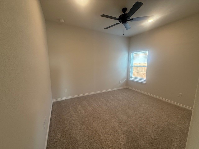 7804 Redbud Road Navasota, TX 77868 - Photo 6 of 25 an empty room with a chandelier fan and windows