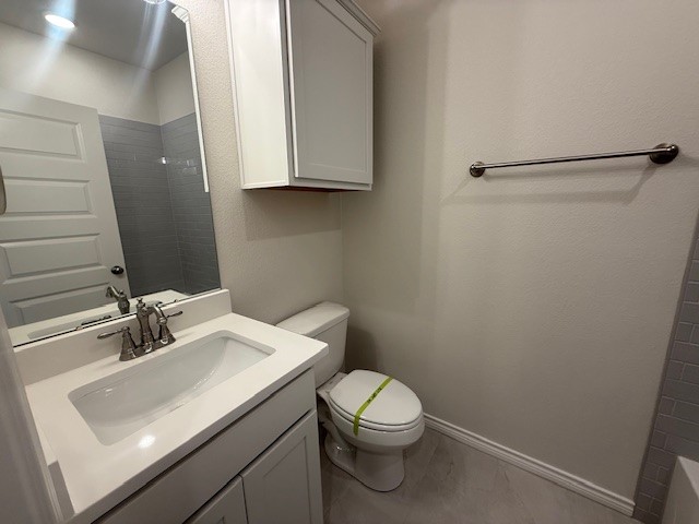 7804 Redbud Road Navasota, TX 77868 - Photo 9 of 25 a bathroom with a sink a toilet and mirror