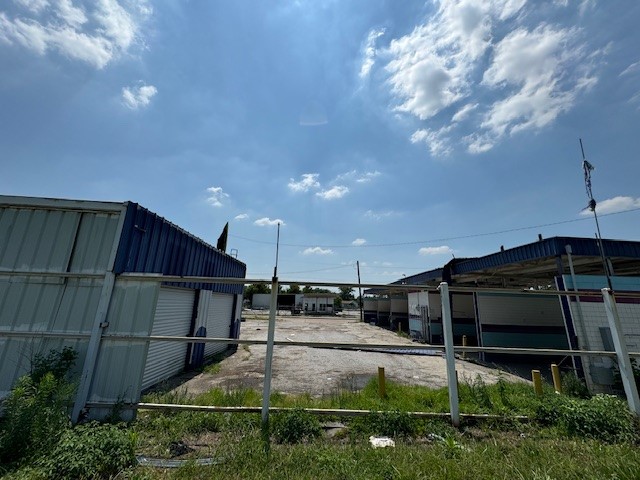 1602 Collingsworth Street Houston, TX 77009 - Photo 12 of 15 a view of backyard with wheel chair and potted plants