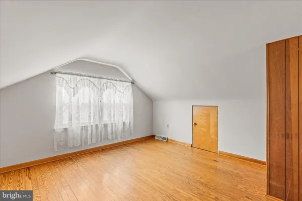 an empty room with a empty space and a window