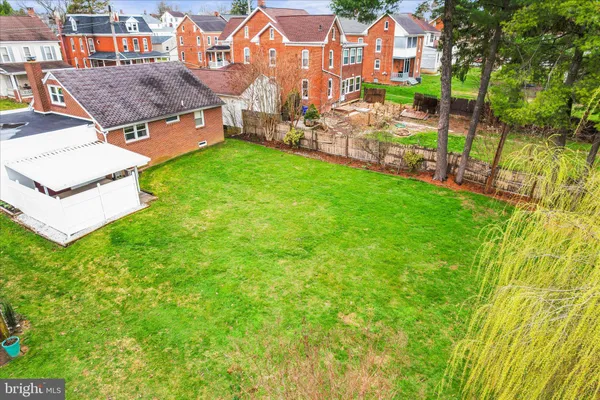an aerial view of residential house with outdoor space